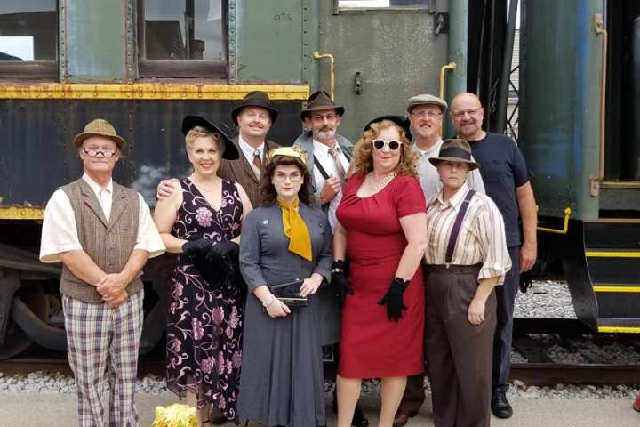 a group of people posing for the camera