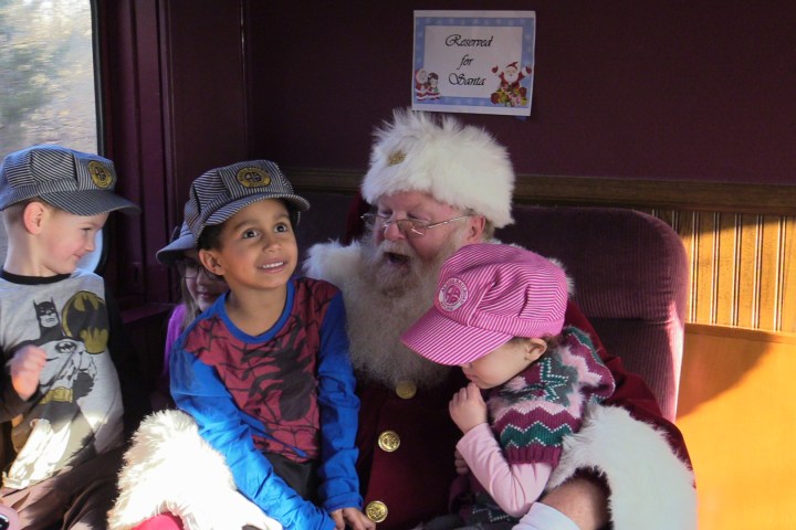 a group of people sitting on a bed