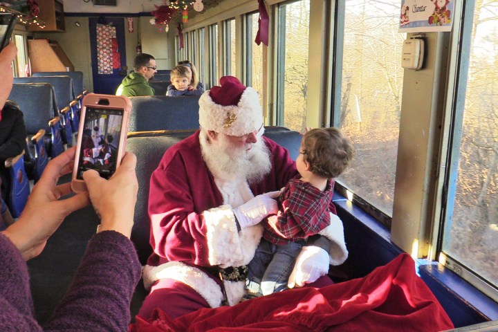 a group of people sitting at a train station