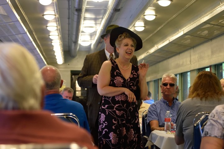 a group of people looking at a station