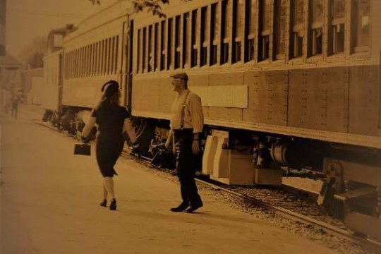 a group of people walking down a street