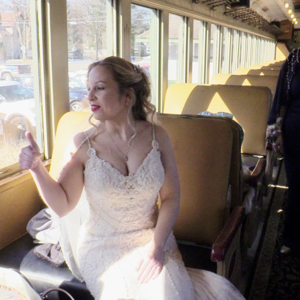 a woman standing in front of a window