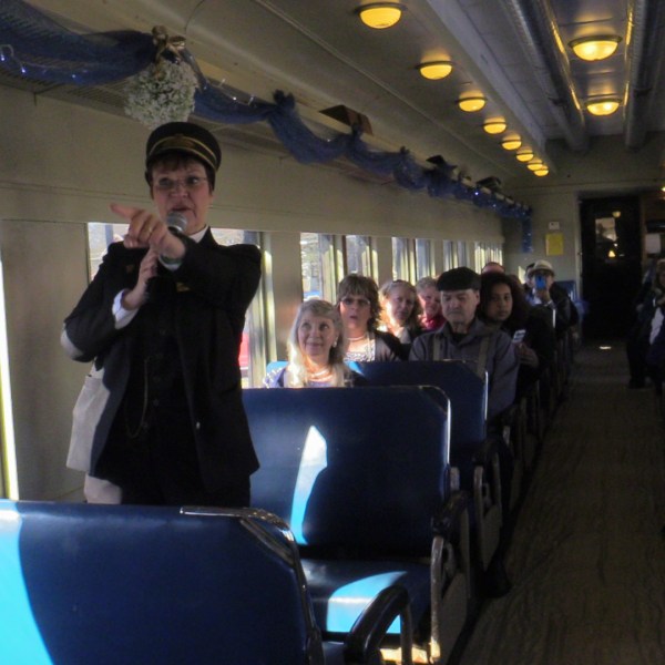 a group of people sitting at a train station