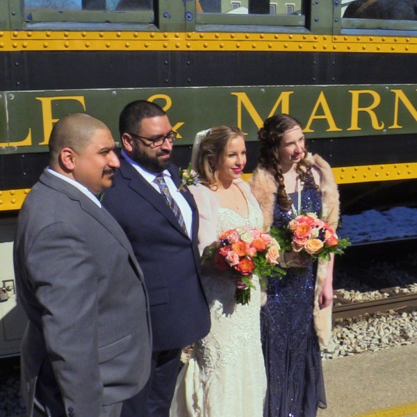 a person standing next to a train