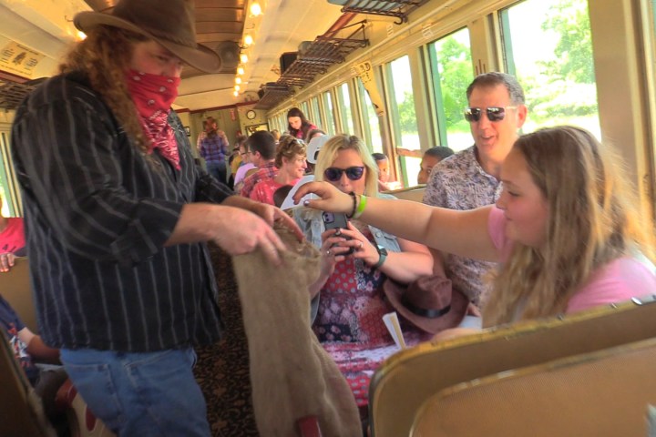 a group of people sitting in front of a window