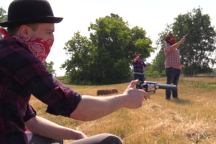 a man holding a baseball bat on a field