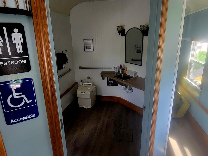 a room with a sink and a mirror