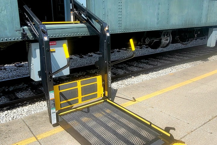 a train is parked on the side of a building